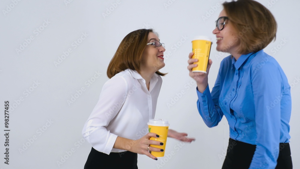 Businesswomen on coffee break telling funny stories Businesswomen on coffee break telling funny stories