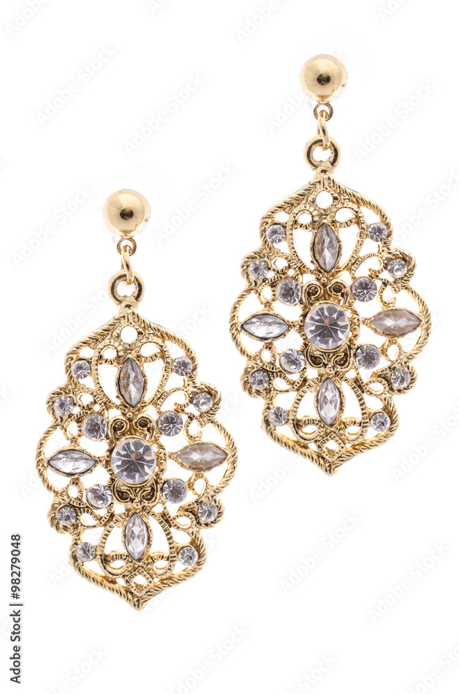 Gold earrings inlaid with precious stones on a white background Gold earrings inlaid with precious stones on a white background