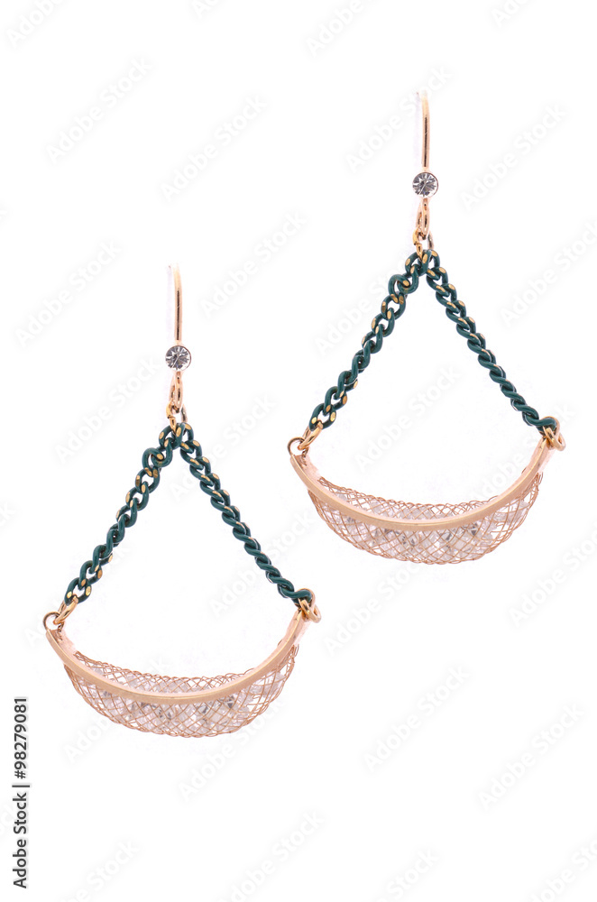 Gold earrings inlaid with gemstones on a white background Gold earrings inlaid with gemstones on a white background