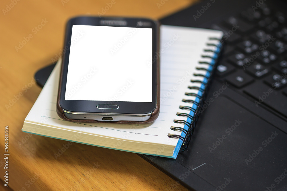 Laptop with book and smartphone Laptop with book and smartphone