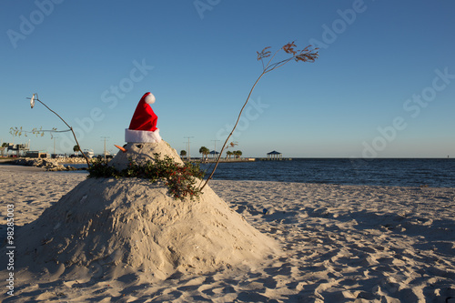 Southern sand snowman with Santa hat