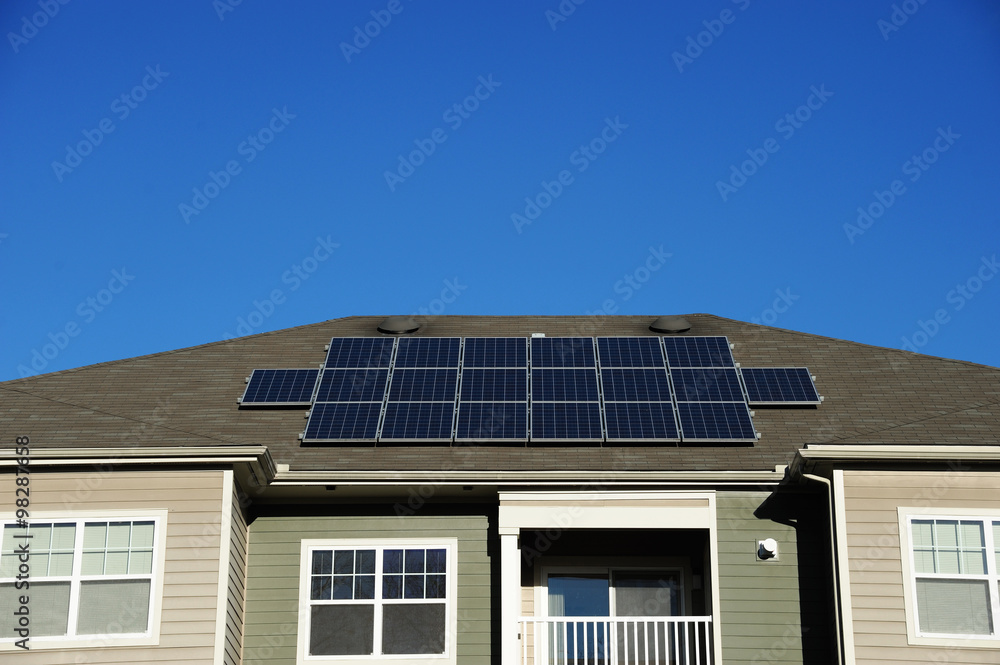 modern apartment and solar panels installed on roof