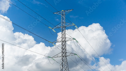 high voltage pole on blue sky with cloud