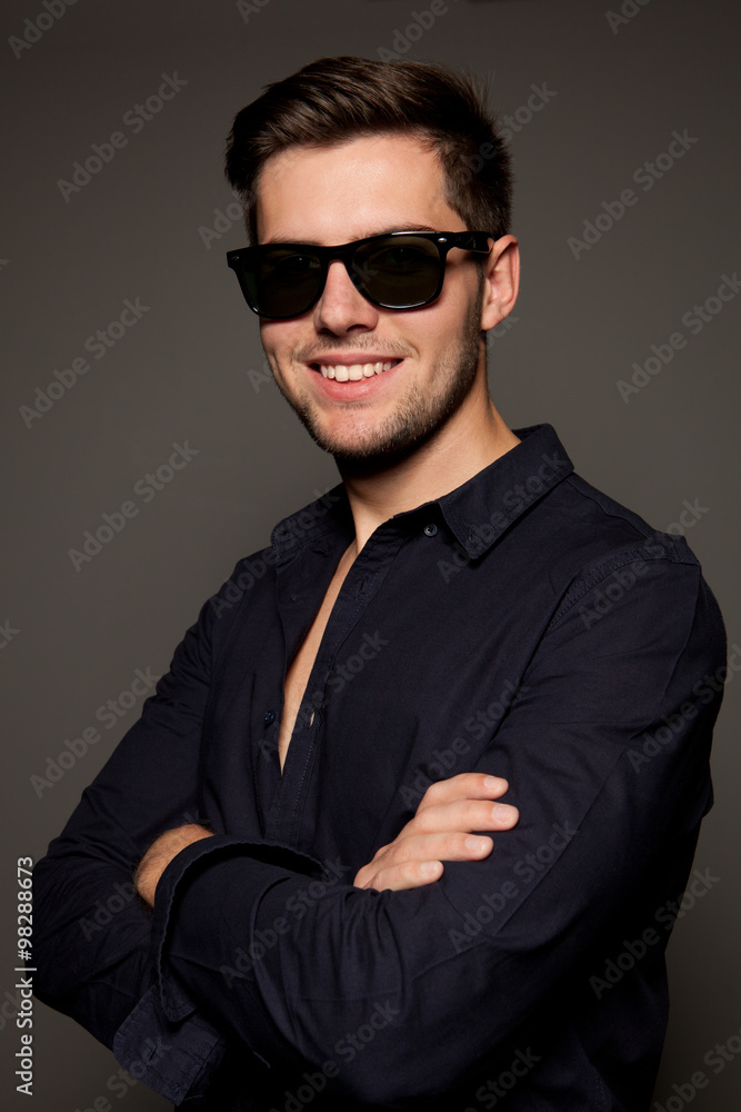 portrait of a young man on a gray background portrait of a young man on a gray background