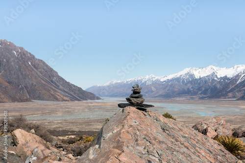 Pyramid of stones on background of mountain and valley, New Zeal