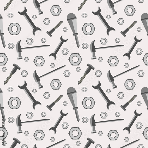 Seamless vector pattern with tools. Chaotic baackground with screws, nuts, hammers, wrenches and screwdrivers on the grey backdrop.