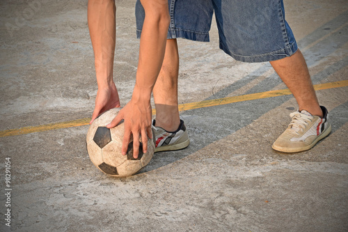 fell vacant soccer ball on concrete floor (street soccer)