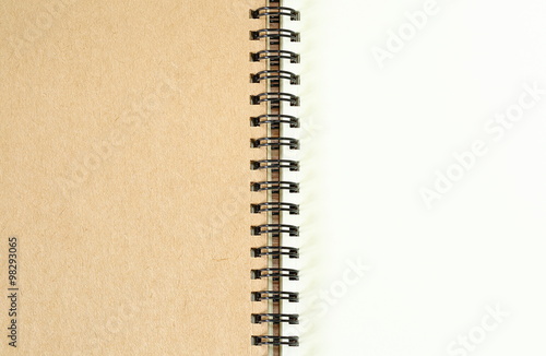 Open blank spiral note book background.