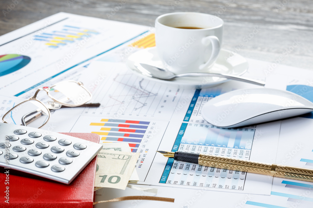 Financial charts and graphs on the table Financial charts and graphs on the table