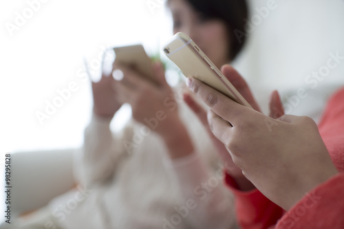 The hands of women who have a smartphone © Monet