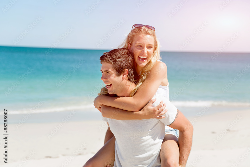 Portrait of man carrying girlfriend on his back Portrait of man carrying girlfriend on his back