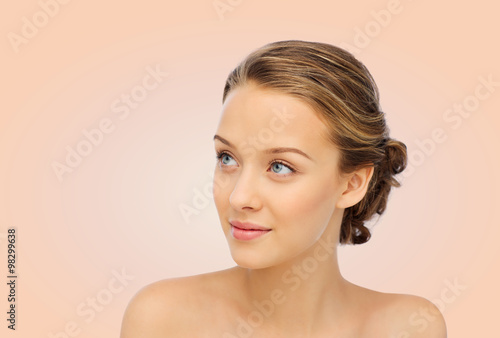 smiling young woman face and shoulders