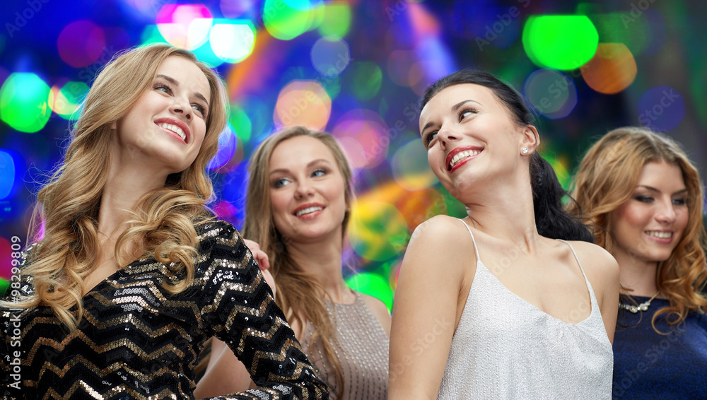 happy young women dancing at night club disco happy young women dancing at night club disco