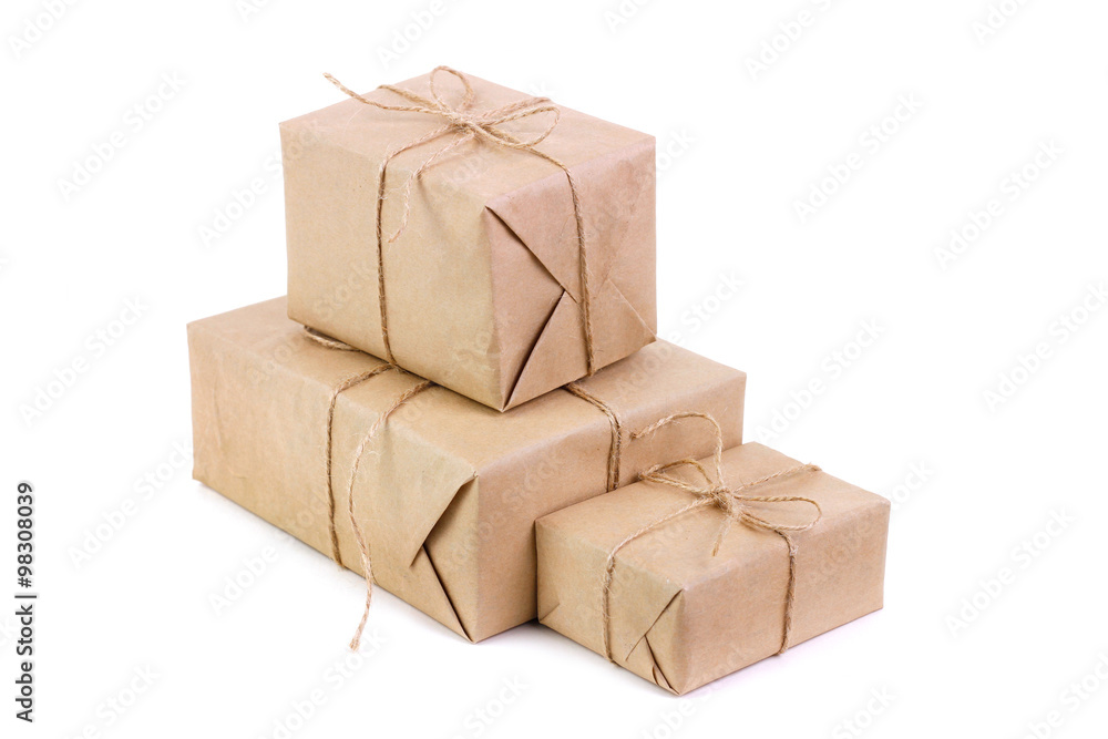 Three packages packed in kraft paper Three packages packed in kraft paper