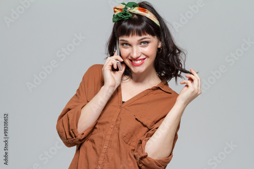 Wallpaper Mural Beautiful cheerful young woman talking on cellphone Torontodigital.ca