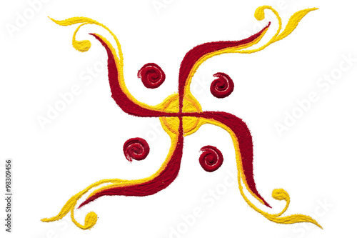 Top view close up of colorful swastik rangoli symbol isolated on white background.