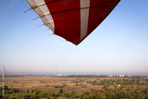 Landscape shot with a paraglider photo