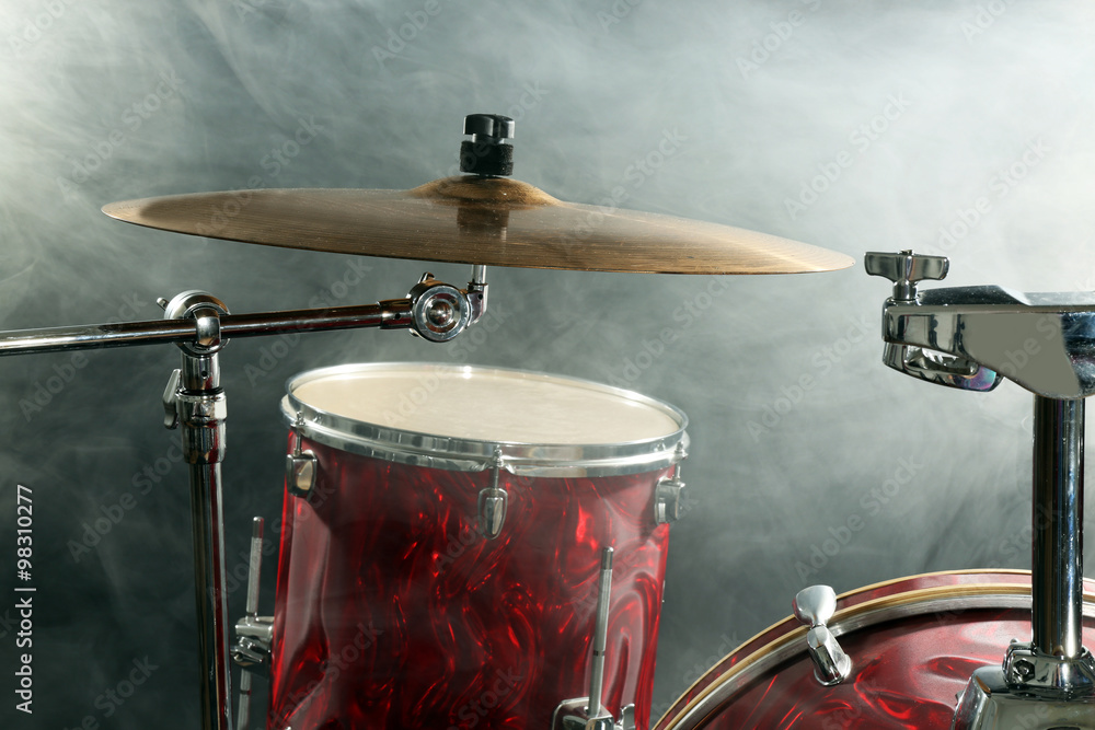 Obraz premium Drum set in smoke on a stage