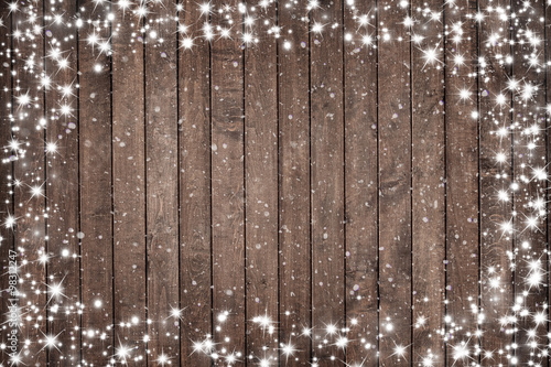 Wooden background with snow flakes . Christmas background