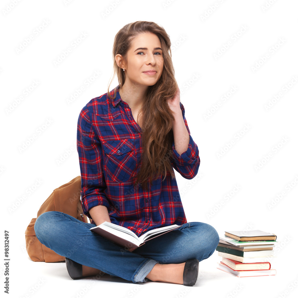 Portrait of happy female student reading a book isolated. Portrait of happy female student reading a book isolated.