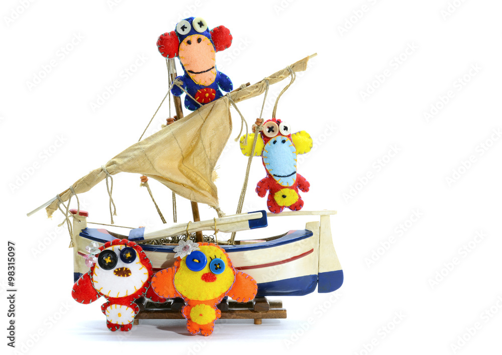 Felt monkeys on the Ship.Isolated on white background