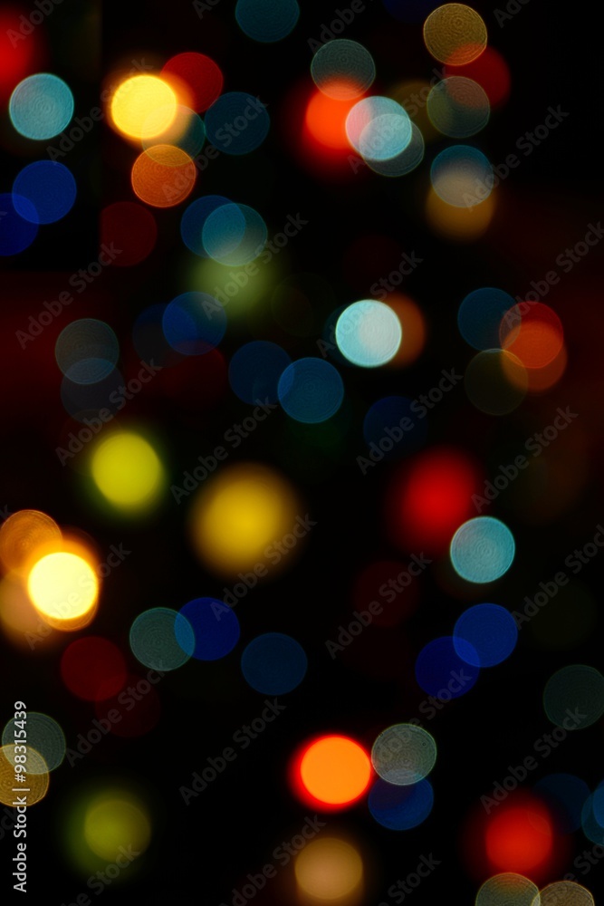 Fototapeta premium Color blurred bokeh lights. Useful for Christmas background or greeting cards.