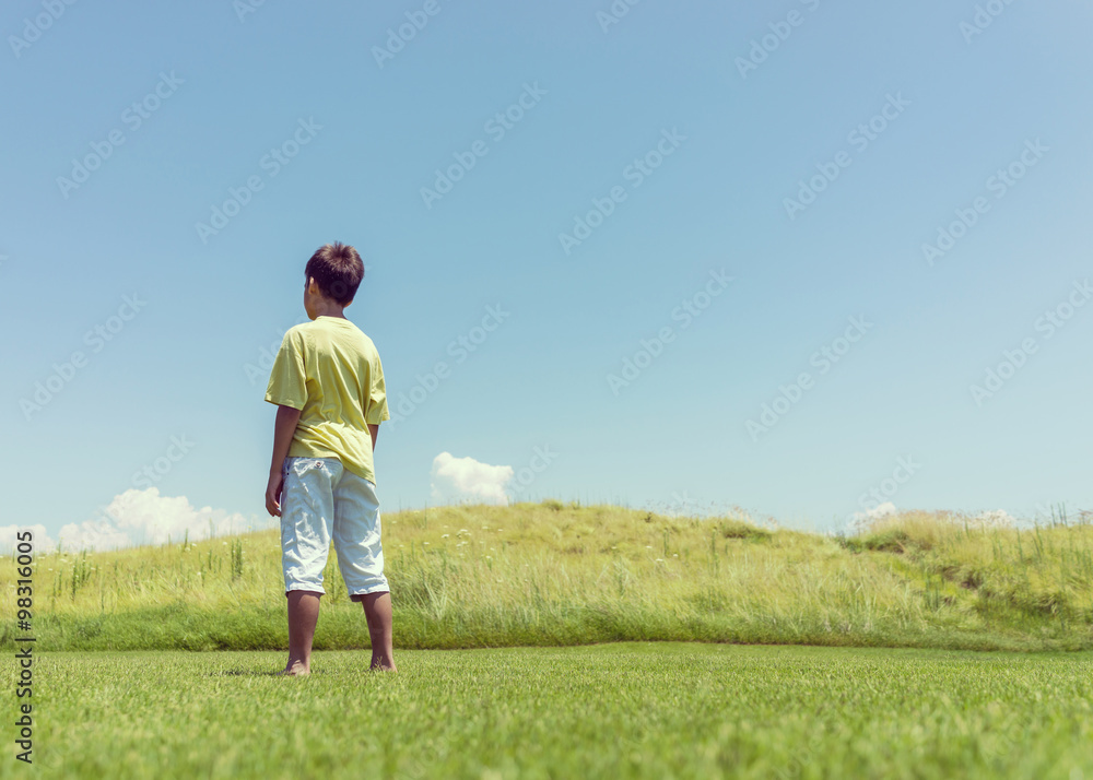 Boy with open hands in beautiful nature Boy with open hands in beautiful nature