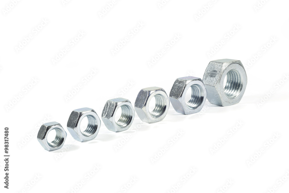 Metal Nuts Lined Up From Smallest To Largest Isolated On White Metal Nuts Lined Up From Smallest To Largest Isolated On White