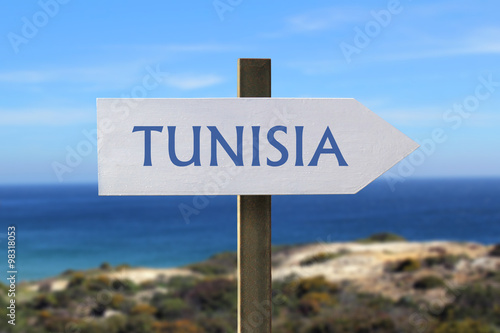 Tunisia sign with seaside in the background