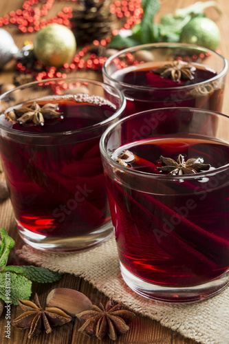 mulled wine in a glass with cinnamon and dittany