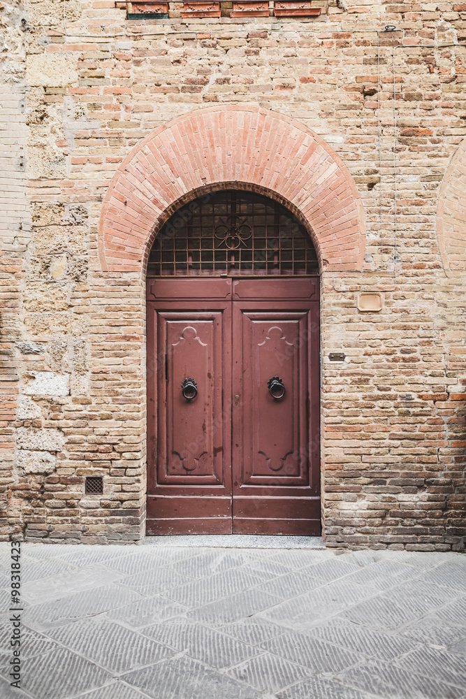 Wooden Door in a Medieval Town of Tuscany, Italy
