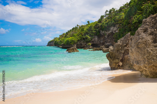 Beautiful landscape of tropical beach, rocks with vegetation, se © frolova_elena