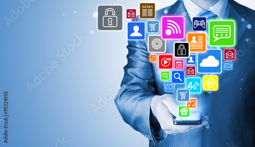 Business man using smart phone with social media icon set © Natalia Merzlyakova