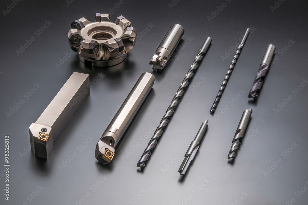 Auto parts and drilling bits photo on black background Auto parts and drilling bits photo on black background