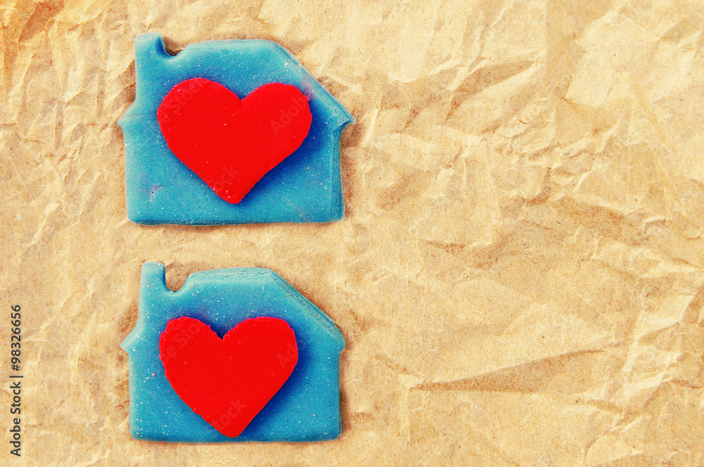 Two red hearts in a lodge on crumpled yellow paper. A card with scenery from plasticine by St. Valentine's Day. Romantic festive card. Valentine's Day card. Two red hearts in a lodge on crumpled yellow paper. A card with scenery from plasticine by St. Valentine's Day. Romantic festive card. Valentine's Day card.