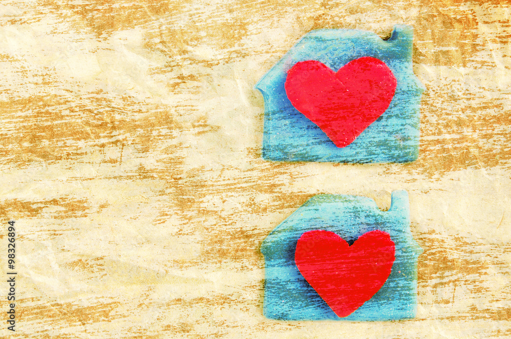 Two red hearts in a lodge on crumpled yellow paper. A card with scenery from plasticine by St. Valentine's Day. Romantic festive card. Valentine's Day card. Two red hearts in a lodge on crumpled yellow paper. A card with scenery from plasticine by St. Valentine's Day. Romantic festive card. Valentine's Day card.