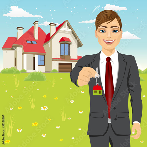 real estate agent holding the key of a new house
