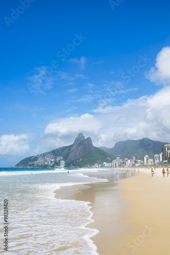 Empty scenic view of the shore of Ipanema Beach against a backdrop of Two Brothers (Dois Irmaos) Mountain Rio de Janeiro, Brazil