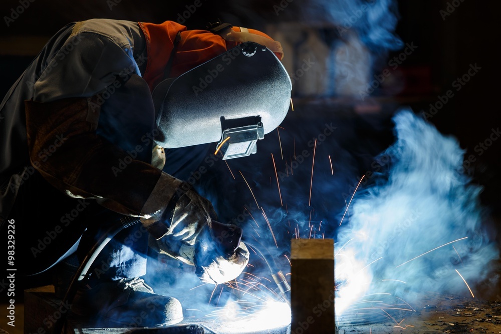 Worker fabricate structure by flux cored wire arc welding process Worker fabricate structure by flux cored wire arc welding process
