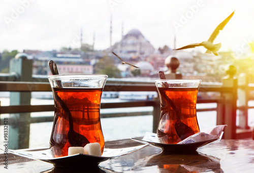 Turkish tea cup on the background of port in Istanbul photo