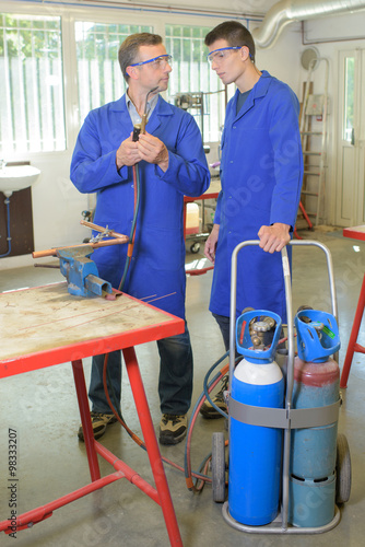 Apprentice learning to use a gas burner