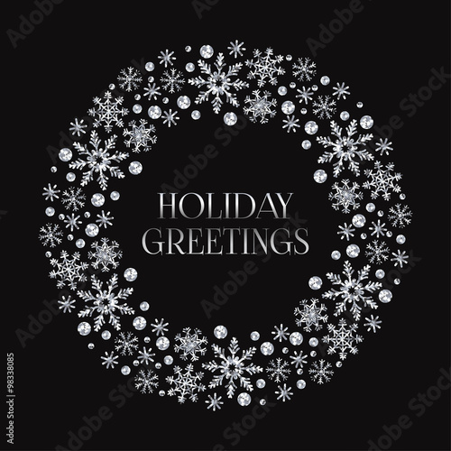Round frame with silver shiny snowflakes. Beautiful greeting card for New Year or Christmas. Background for your design.
