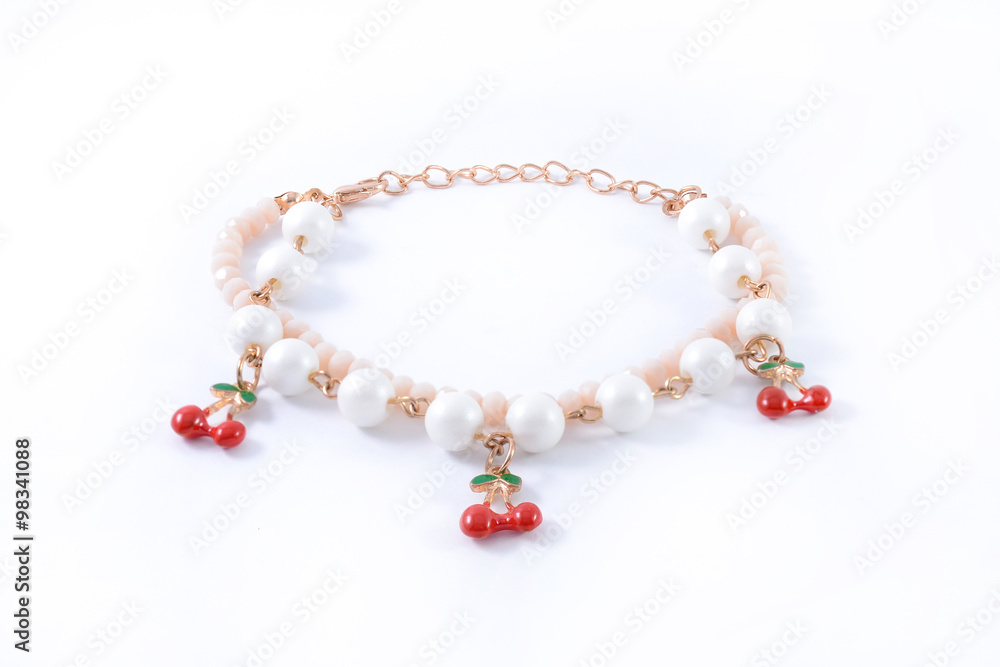 bracelet with pearls and pendants isolated on white bracelet with pearls and pendants isolated on white
