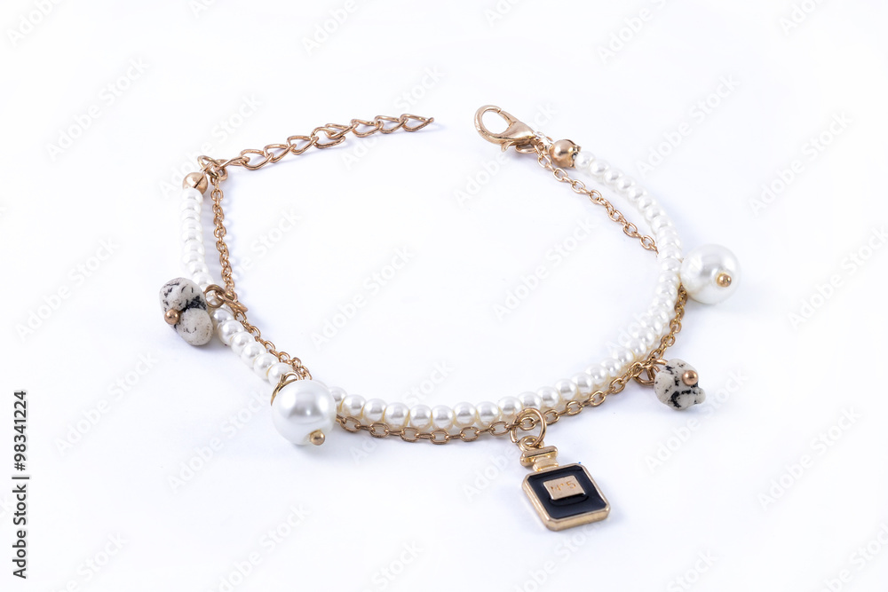 bracelet with pearls and pendants isolated on white bracelet with pearls and pendants isolated on white