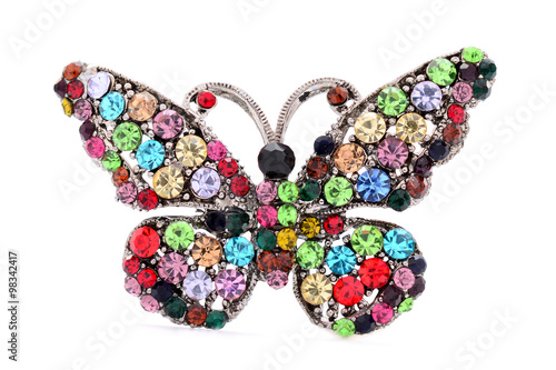 brooch in the shape of a butterfly on a white background