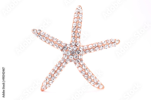brooch in the shape of a starfish on a white background