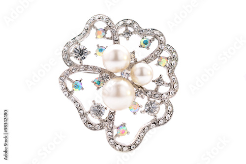 brooch in the shape of a flower on a white background
