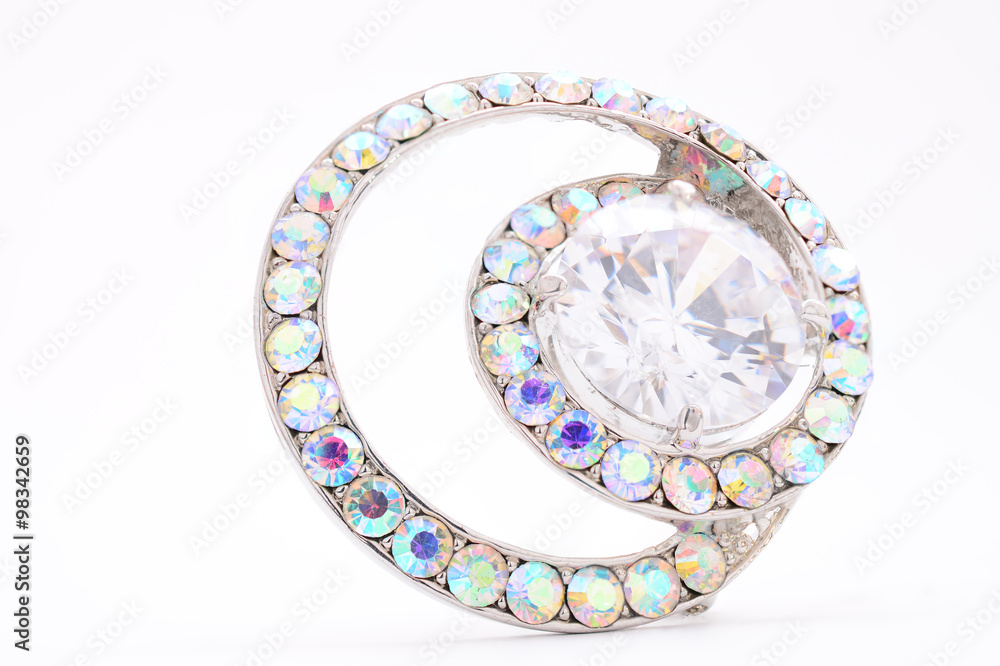 round brooch with gems on a white background round brooch with gems on a white background