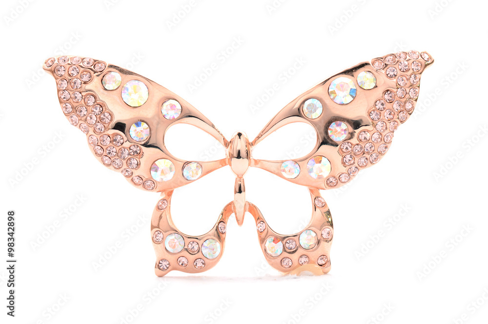 Fototapeta premium Brooch in the form of a golden butterfly on a white background