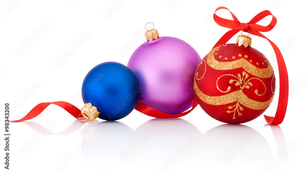Three colored Christmas baubles with ribbon bow isolated on whit